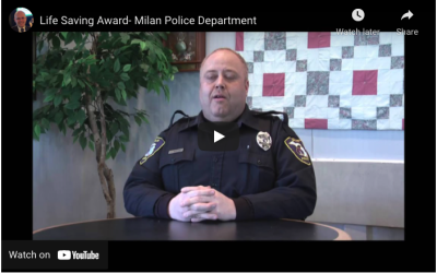 Officer Justo Burgos of the Milan (MI) Police Department receives a life saving award