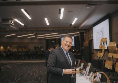 2024_08_A2Y_Gala_2023_Man smiling while holding a glass.O